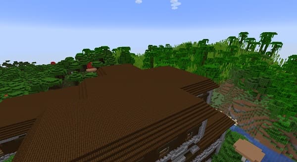 Empty glass jar with a metal lid on a wooden surface.