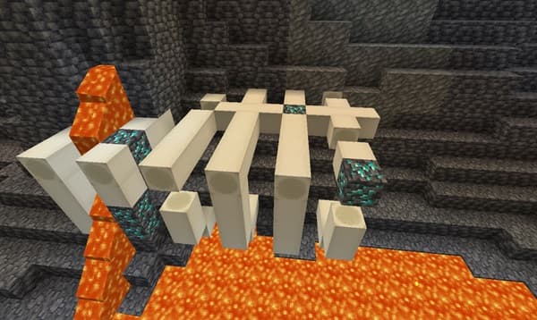 Red barn with white trim and a green roof in a rural setting.