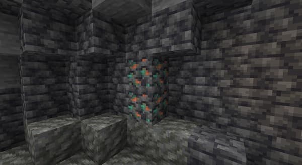 A modern laptop on a wooden desk with a minimalist plant and a coffee mug, perfect for remote work.