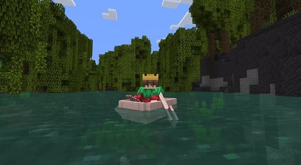 Red-white striped lighthouse against a clear blue sky.