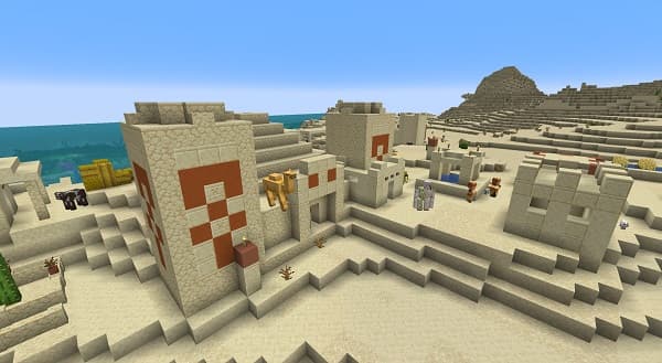 A black notebook and pen on a white desk.