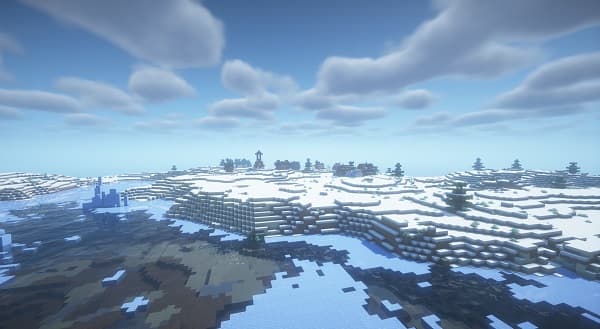 Young woman in a pink top using a laptop with a serious expression, working from home.