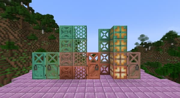 A person using a laptop and smartphone.