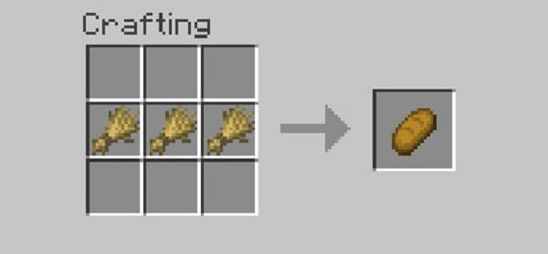 A person typing on a laptop with a blank screen.