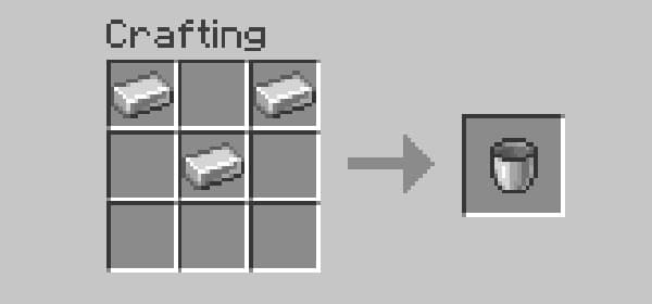 Empty office desk with a laptop and a plant, ready for remote work.