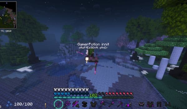 A person's hands holding a modern smartphone, scrolling through a social media feed.