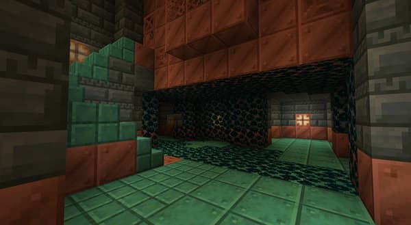 A serene river flowing through a lush, green forest under a clear sky.