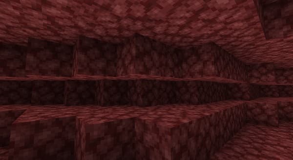 Blurred background of a light blue wall with dark shadows.