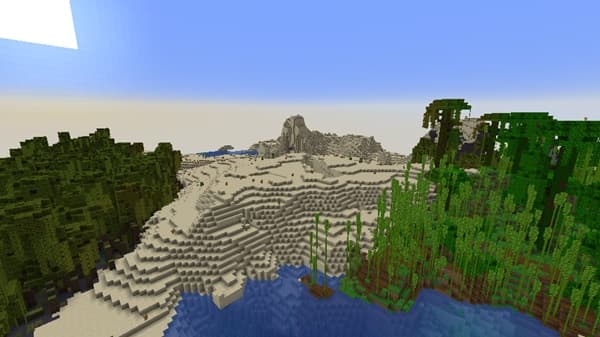 Empty office desk with a laptop, notebook, and pen, ready for work.