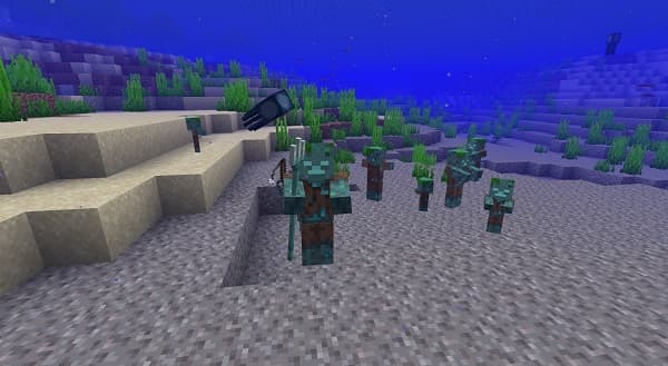 Young woman in a vibrant yellow coat walking through a lush green field under a clear sky.