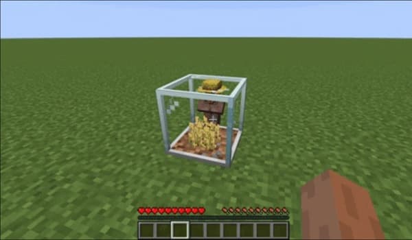 A large, modern building with many windows and a distinctive roofline against a clear sky.