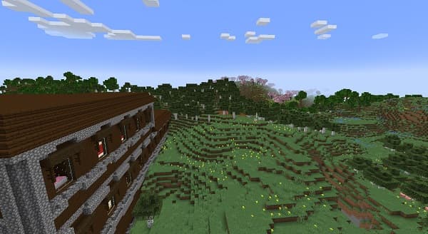 Man playing guitar in a park setting, enjoying the music outdoors.