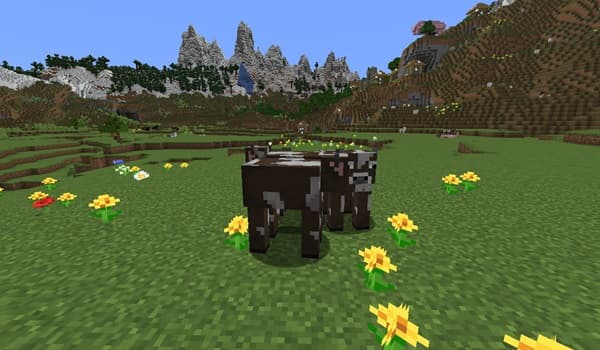 A child smiling while playing with colorful building blocks.