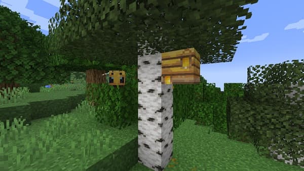 A young girl with a ponytail and blue top poses with a colorful drawing.