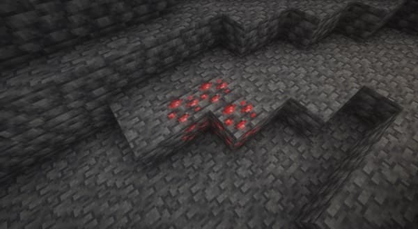 A blurred image with a dark foreground and a lighter, abstract background.