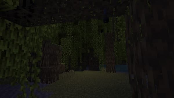 Woman smiling at computer while working from home.