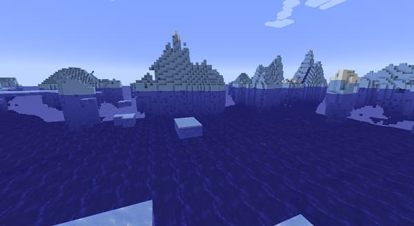 A person standing in a green field with trees under a blue sky.