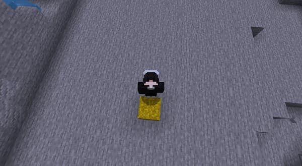 A child holding a drawing of a smiling sun.