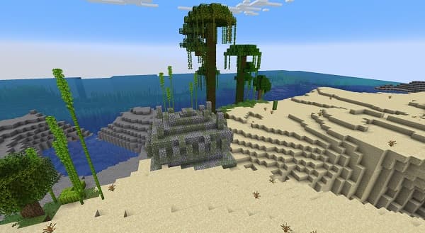 An empty room with white walls and a light wood floor.