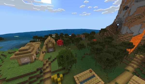 A large, old oak tree stands alone in a misty field at dawn, bathed in soft light.