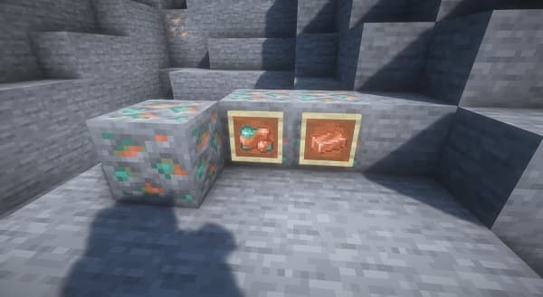 Red brick house with a green door and two windows.