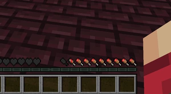 Young man playing acoustic guitar with sheet music.