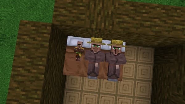 Old red pickup truck driving on a country road at sunset.