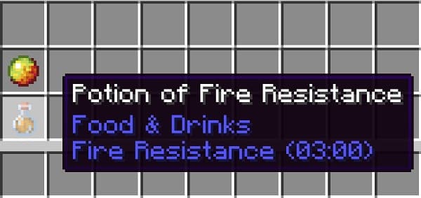 A young woman in a beige outfit sits on a green chair, her hands clasped on her lap, against a plain white wall.