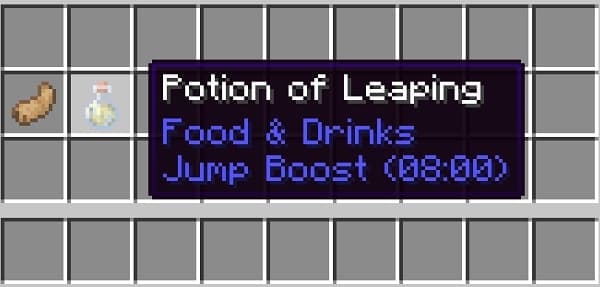 A tranquil lake surrounded by a lush green forest under a clear sky.