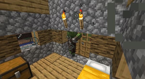 A white cat with blue eyes sitting on a couch.