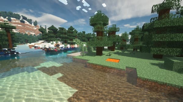 Man in black t-shirt and shorts running on a dirt trail.