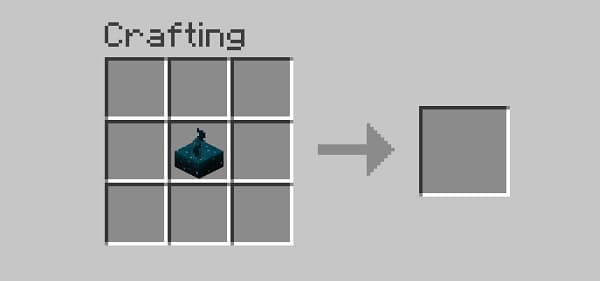 Red and white striped awning with a white flag against a blue sky.