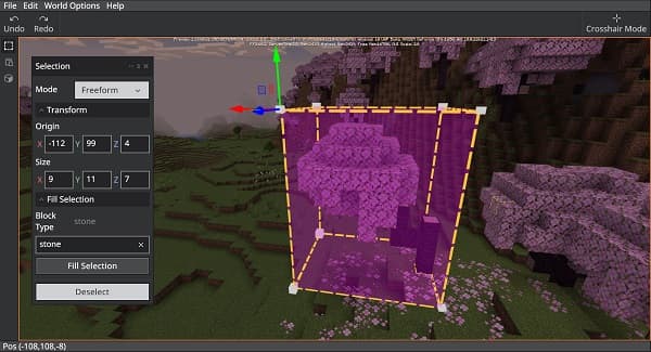 A young woman in a denim jacket looking thoughtfully at a phone.