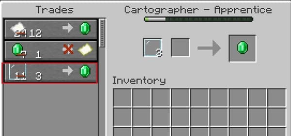 Woman using a laptop with a modern office setup.