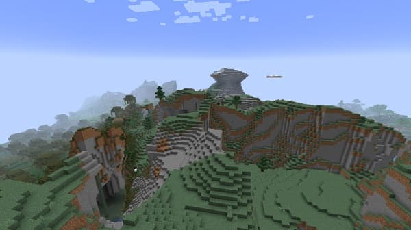 A close-up view of a green cactus plant with sharp spines.