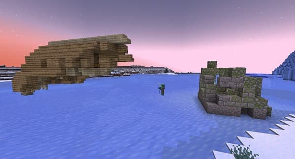 A stack of two colorful striped bath towels.