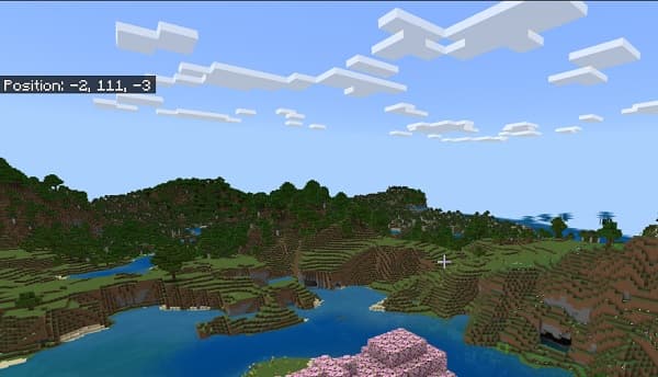 A serene mountain lake reflecting the sky and surrounding trees.