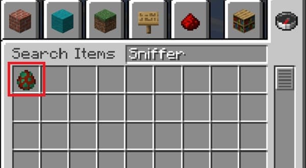 Young man wearing headphones and glasses, looking at a laptop.