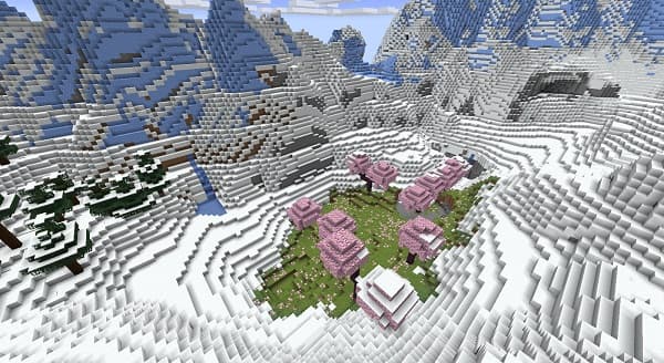 Empty living room with blank white walls and light-colored wood floor.