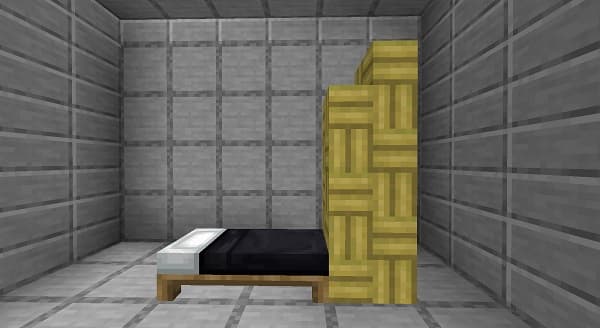 An antique, ornate silver serving tray on a wooden table.