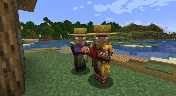 A small, vibrant green chameleon with rough skin and a long, curly tail perched on a leafy branch.