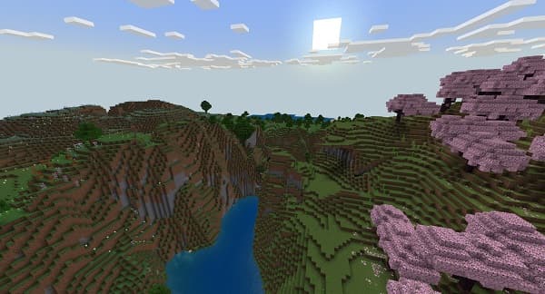 Empty industrial warehouse with a high ceiling and large overhead doors.