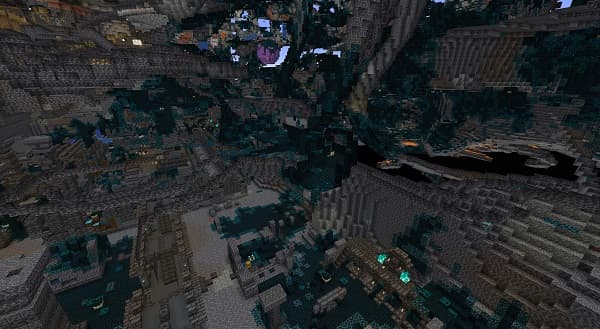 A cozy modern living room with a gray sectional sofa and a large window.