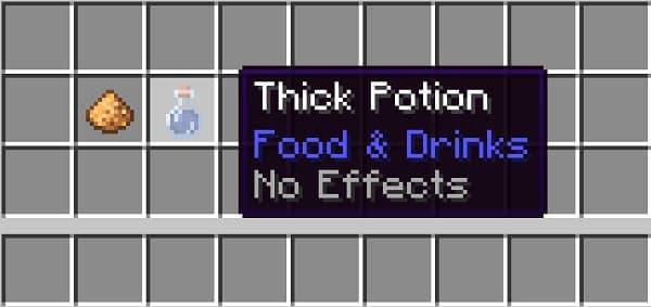 Person typing on a laptop with a modern desk setup.