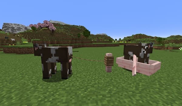 A lone, leafless tree stands starkly against a bright, hazy sky.