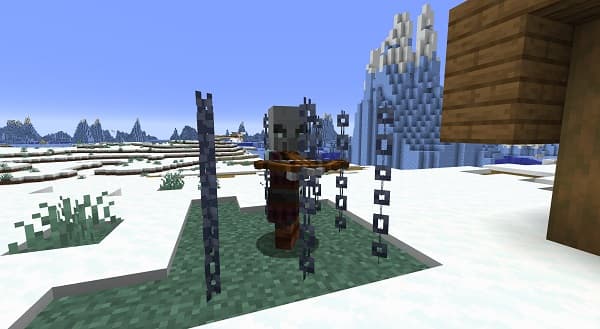 A serene, empty beach with white sand and clear blue water stretching to the horizon.