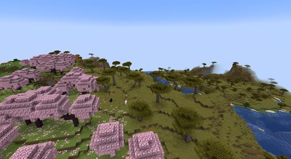 A cozy, rustic living room with a stone fireplace and warm lighting.