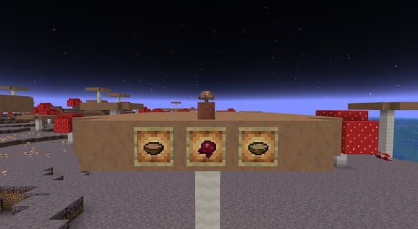 A person standing outdoors, looking at a mountain range under a cloudy sky.