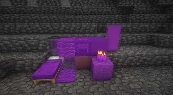 Empty office desk with a laptop and a plant, ready for a productive workday.