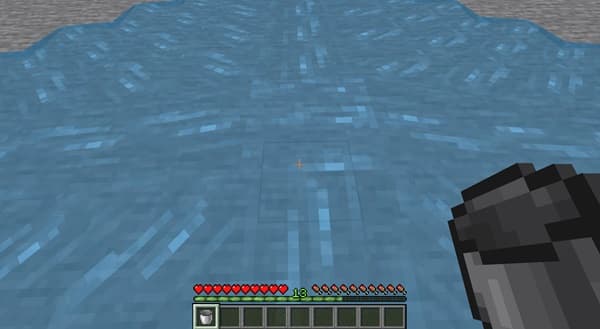 A close-up shot of a white ceramic plate with a gold rim.